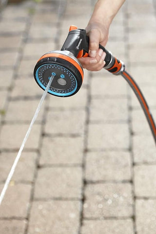 Gardena multi sprayer rinsing paving stones with a jet