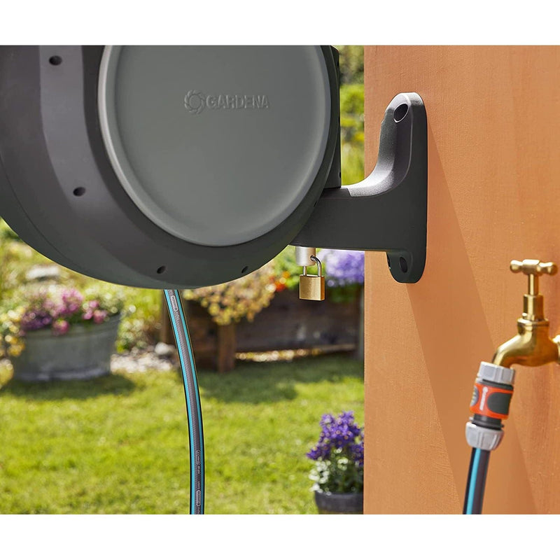Gardena RollUp reel on its bracket beside an outdoor faucet