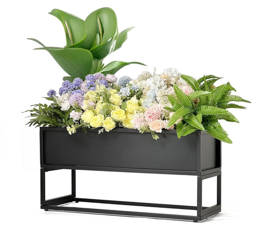 Cocoyard low metal planter box on legs, planted with flowers and ferns